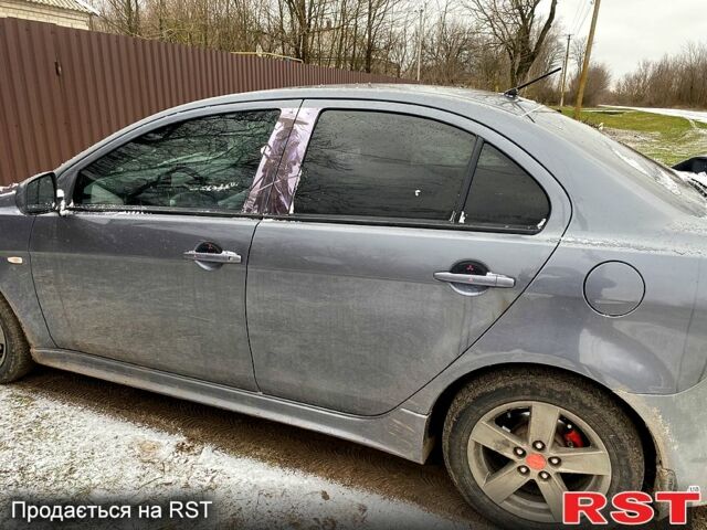 Серый Мицубиси Лансер, объемом двигателя 2 л и пробегом 190 тыс. км за 5600 $, фото 1 на Automoto.ua