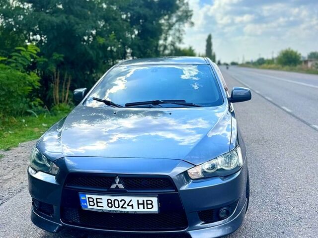 Серый Мицубиси Лансер, объемом двигателя 2 л и пробегом 250 тыс. км за 5800 $, фото 1 на Automoto.ua