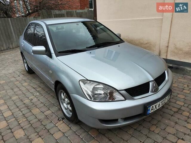 Серый Мицубиси Лансер, объемом двигателя 1.58 л и пробегом 185 тыс. км за 4700 $, фото 1 на Automoto.ua