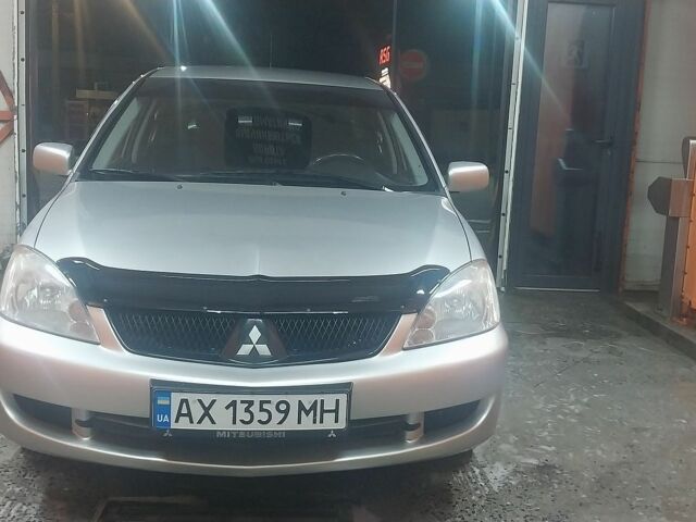 Сірий Міцубісі Lancer, об'ємом двигуна 1.58 л та пробігом 250 тис. км за 4500 $, фото 1 на Automoto.ua