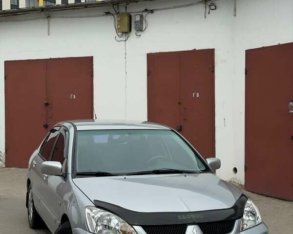 Серый Мицубиси Лансер, объемом двигателя 1.58 л и пробегом 199 тыс. км за 3650 $, фото 1 на Automoto.ua