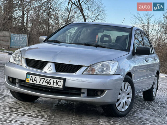 Сірий Міцубісі Lancer, об'ємом двигуна 1.58 л та пробігом 208 тис. км за 3999 $, фото 1 на Automoto.ua