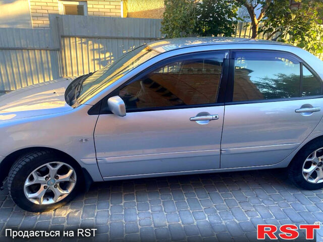 Серый Мицубиси Лансер, объемом двигателя 1.6 л и пробегом 241 тыс. км за 4800 $, фото 1 на Automoto.ua