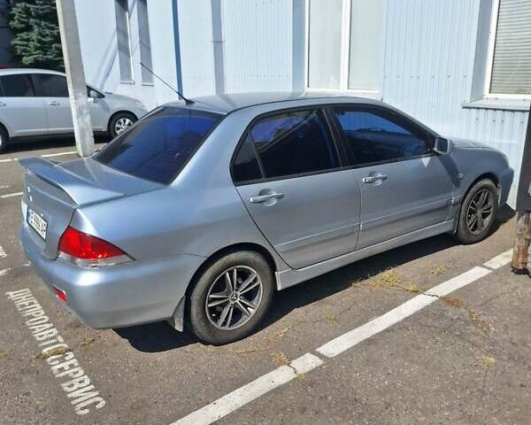 Сірий Міцубісі Lancer, об'ємом двигуна 1.6 л та пробігом 217 тис. км за 6000 $, фото 1 на Automoto.ua