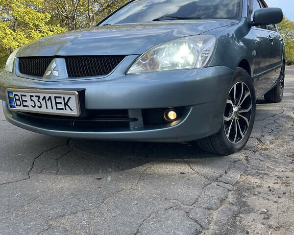 Серый Мицубиси Лансер, объемом двигателя 1.6 л и пробегом 186 тыс. км за 5300 $, фото 1 на Automoto.ua