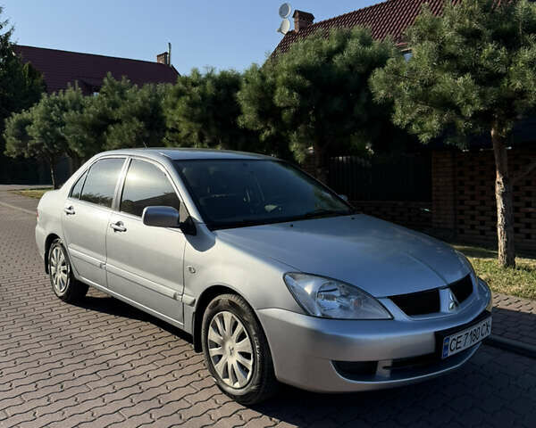 Сірий Міцубісі Lancer, об'ємом двигуна 1.58 л та пробігом 113 тис. км за 6700 $, фото 1 на Automoto.ua
