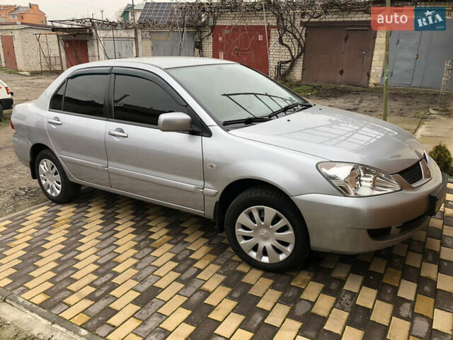 Серый Мицубиси Лансер, объемом двигателя 1.6 л и пробегом 132 тыс. км за 5700 $, фото 1 на Automoto.ua
