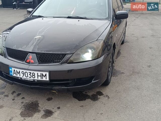Серый Мицубиси Лансер, объемом двигателя 1.6 л и пробегом 146 тыс. км за 2250 $, фото 1 на Automoto.ua