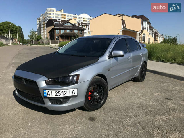 Серый Мицубиси Лансер, объемом двигателя 2 л и пробегом 256 тыс. км за 7000 $, фото 1 на Automoto.ua