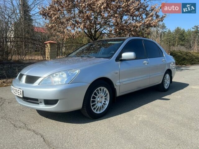 Серый Мицубиси Лансер, объемом двигателя 1.58 л и пробегом 255 тыс. км за 4300 $, фото 1 на Automoto.ua