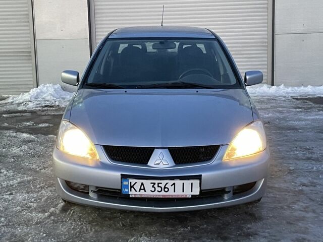 Серый Мицубиси Лансер, объемом двигателя 1.6 л и пробегом 311 тыс. км за 4500 $, фото 1 на Automoto.ua