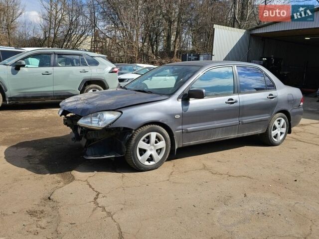Серый Мицубиси Лансер, объемом двигателя 1.58 л и пробегом 200 тыс. км за 1799 $, фото 1 на Automoto.ua
