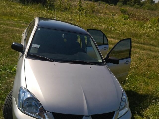 Серый Мицубиси Лансер, объемом двигателя 1.6 л и пробегом 350 тыс. км за 3600 $, фото 1 на Automoto.ua