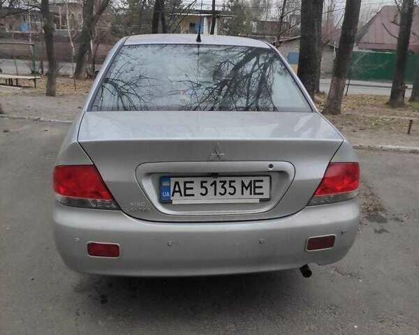 Серый Мицубиси Лансер, объемом двигателя 1.6 л и пробегом 166 тыс. км за 5500 $, фото 1 на Automoto.ua