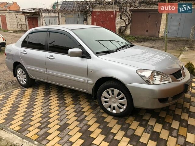 Серый Мицубиси Лансер, объемом двигателя 1.58 л и пробегом 132 тыс. км за 5500 $, фото 1 на Automoto.ua