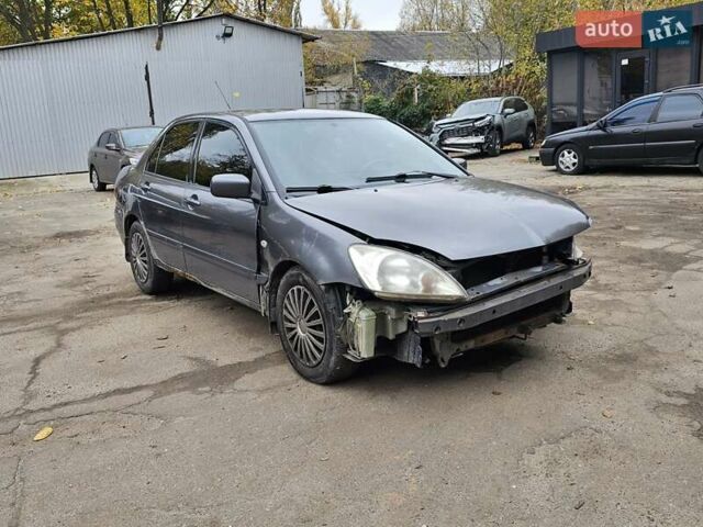 Сірий Міцубісі Lancer, об'ємом двигуна 1.58 л та пробігом 200 тис. км за 1700 $, фото 1 на Automoto.ua