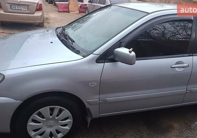 Серый Мицубиси Лансер, объемом двигателя 1.6 л и пробегом 320 тыс. км за 4167 $, фото 1 на Automoto.ua