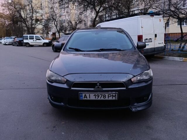 Серый Мицубиси Лансер, объемом двигателя 2 л и пробегом 345 тыс. км за 6500 $, фото 1 на Automoto.ua