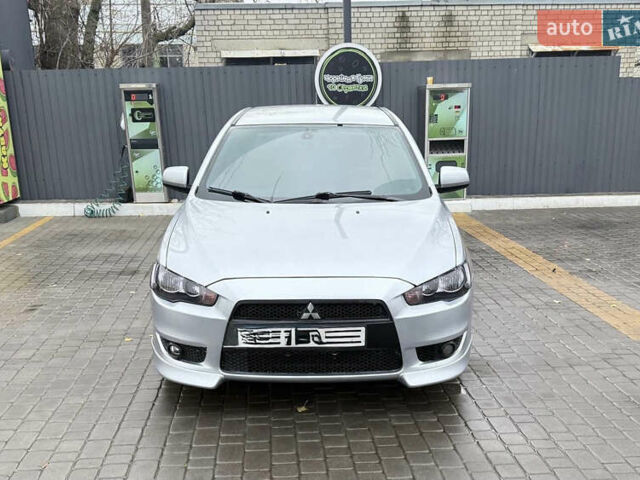 Серый Мицубиси Лансер, объемом двигателя 2 л и пробегом 220 тыс. км за 6500 $, фото 1 на Automoto.ua