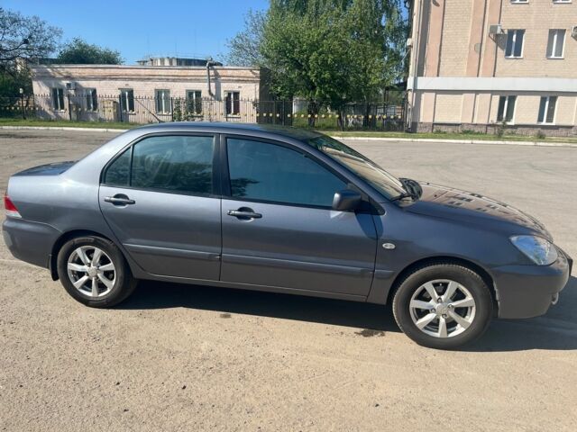 Сірий Міцубісі Lancer, об'ємом двигуна 1.6 л та пробігом 254 тис. км за 4600 $, фото 1 на Automoto.ua