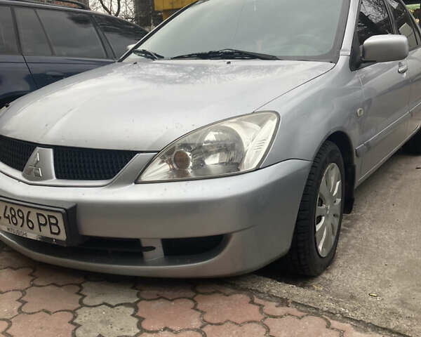 Сірий Міцубісі Lancer, об'ємом двигуна 1.58 л та пробігом 211 тис. км за 4400 $, фото 1 на Automoto.ua