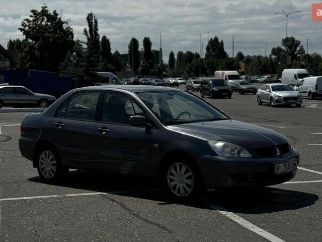 Сірий Міцубісі Lancer, об'ємом двигуна 1.58 л та пробігом 178 тис. км за 4800 $, фото 1 на Automoto.ua