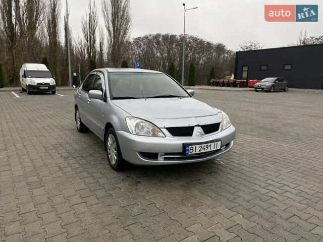 Сірий Міцубісі Lancer, об'ємом двигуна 1.58 л та пробігом 280 тис. км за 4650 $, фото 1 на Automoto.ua