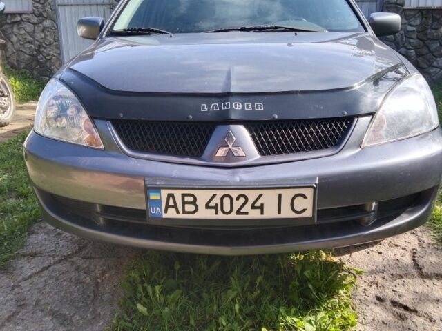 Серый Мицубиси Лансер, объемом двигателя 1.6 л и пробегом 143 тыс. км за 5650 $, фото 1 на Automoto.ua