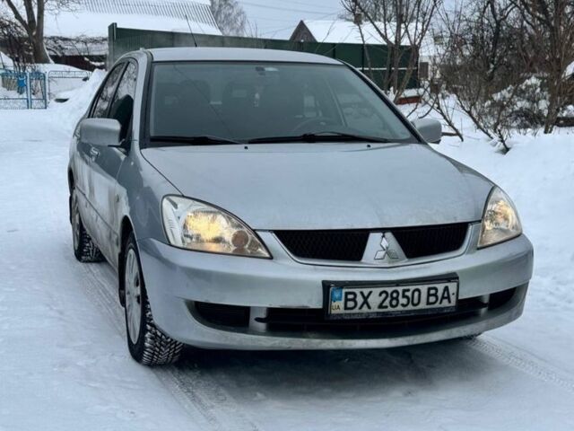 Серый Мицубиси Лансер, объемом двигателя 1.6 л и пробегом 240 тыс. км за 3699 $, фото 1 на Automoto.ua
