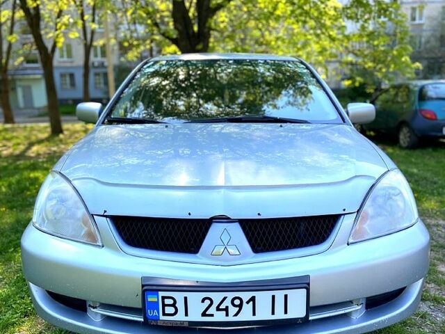 Сірий Міцубісі Lancer, об'ємом двигуна 1.6 л та пробігом 244 тис. км за 4699 $, фото 1 на Automoto.ua