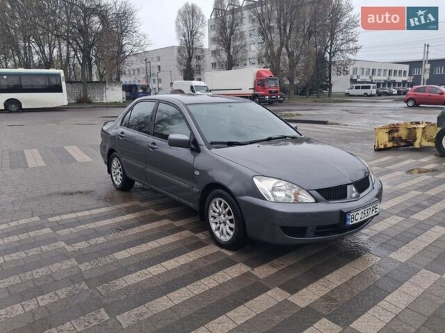 Сірий Міцубісі Lancer, об'ємом двигуна 1.58 л та пробігом 209 тис. км за 2699 $, фото 1 на Automoto.ua