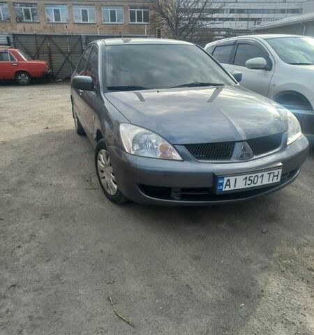 Серый Мицубиси Лансер, объемом двигателя 1.58 л и пробегом 102 тыс. км за 5399 $, фото 1 на Automoto.ua