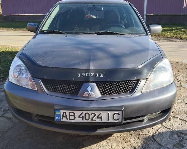 Сірий Міцубісі Lancer, об'ємом двигуна 1.6 л та пробігом 133 тис. км за 5600 $, фото 1 на Automoto.ua