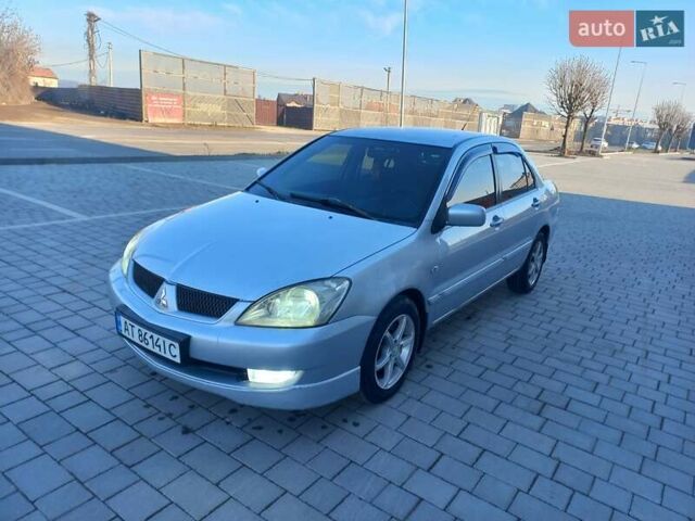 Серый Мицубиси Лансер, объемом двигателя 1.58 л и пробегом 228 тыс. км за 3600 $, фото 1 на Automoto.ua