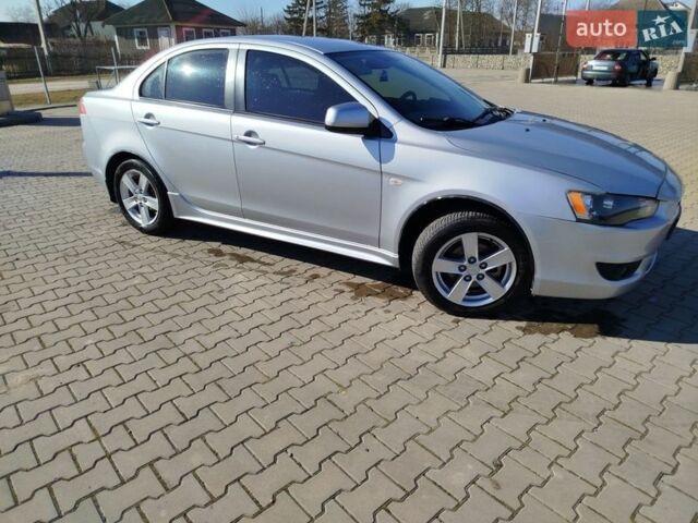 Серый Мицубиси Лансер, объемом двигателя 2 л и пробегом 199 тыс. км за 6400 $, фото 1 на Automoto.ua