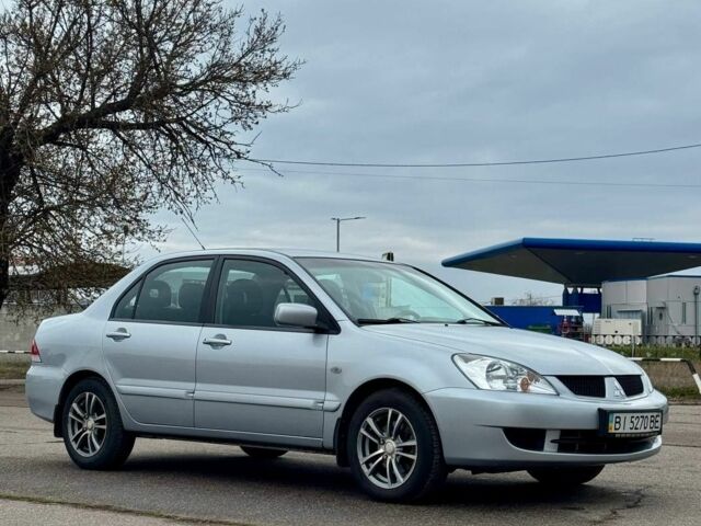 Серый Мицубиси Лансер, объемом двигателя 1.6 л и пробегом 161 тыс. км за 5200 $, фото 1 на Automoto.ua