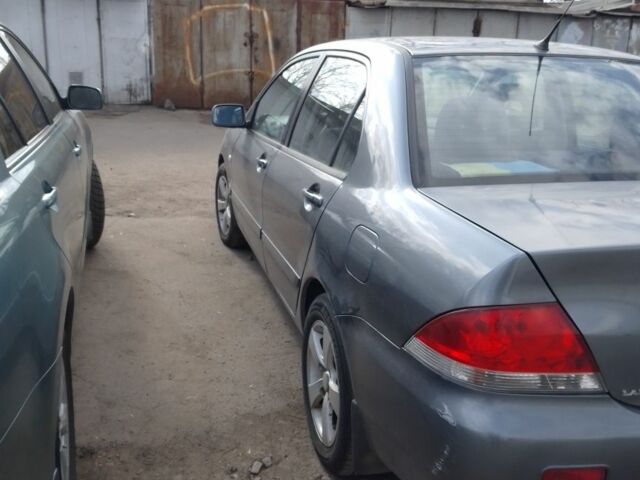 Серый Мицубиси Лансер, объемом двигателя 1.6 л и пробегом 280 тыс. км за 4100 $, фото 1 на Automoto.ua