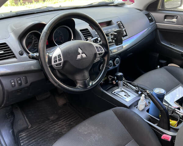 Серый Мицубиси Лансер, объемом двигателя 2 л и пробегом 222 тыс. км за 6999 $, фото 1 на Automoto.ua