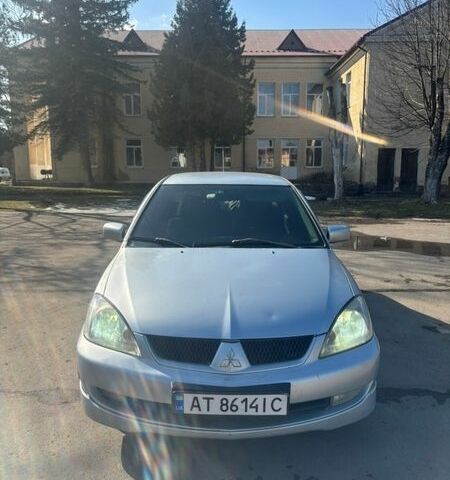 Серый Мицубиси Лансер, объемом двигателя 1.58 л и пробегом 236 тыс. км за 3350 $, фото 1 на Automoto.ua