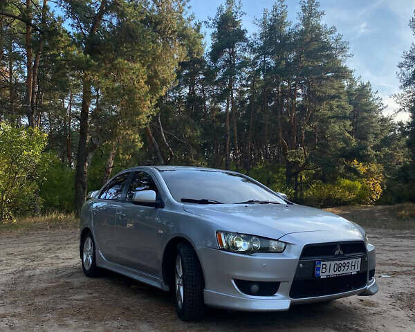 Серый Мицубиси Лансер, объемом двигателя 2 л и пробегом 239 тыс. км за 6999 $, фото 1 на Automoto.ua