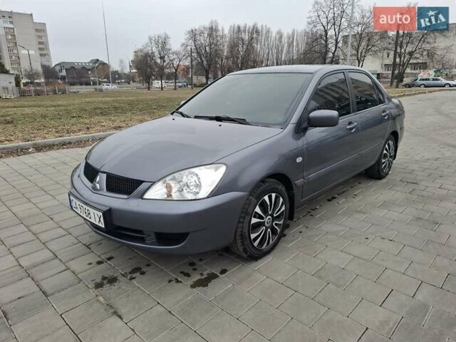 Серый Мицубиси Лансер, объемом двигателя 1.6 л и пробегом 160 тыс. км за 4999 $, фото 1 на Automoto.ua