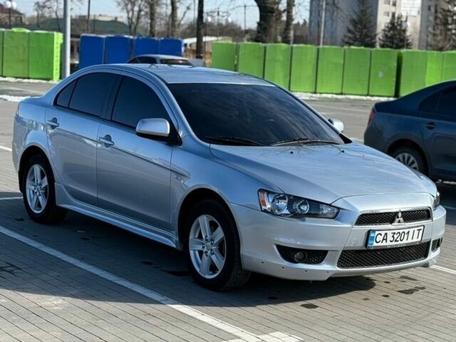 Серый Мицубиси Лансер, объемом двигателя 2 л и пробегом 196 тыс. км за 7000 $, фото 1 на Automoto.ua