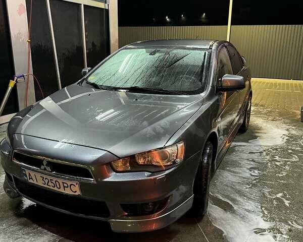 Серый Мицубиси Лансер, объемом двигателя 1.8 л и пробегом 213 тыс. км за 7100 $, фото 1 на Automoto.ua