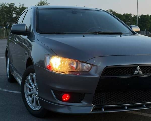 Серый Мицубиси Лансер, объемом двигателя 2 л и пробегом 191 тыс. км за 7900 $, фото 1 на Automoto.ua
