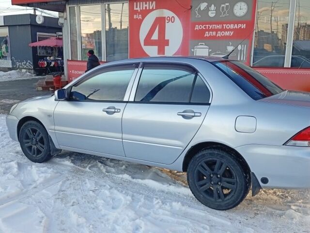 Серый Мицубиси Лансер, объемом двигателя 1.6 л и пробегом 312 тыс. км за 5500 $, фото 1 на Automoto.ua