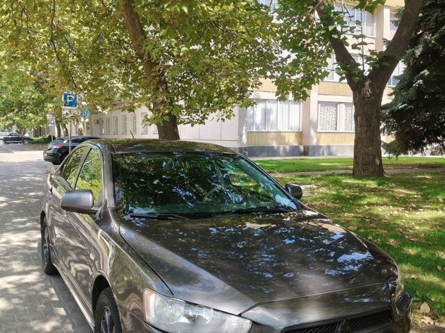 Серый Мицубиси Лансер, объемом двигателя 2 л и пробегом 230 тыс. км за 7650 $, фото 1 на Automoto.ua