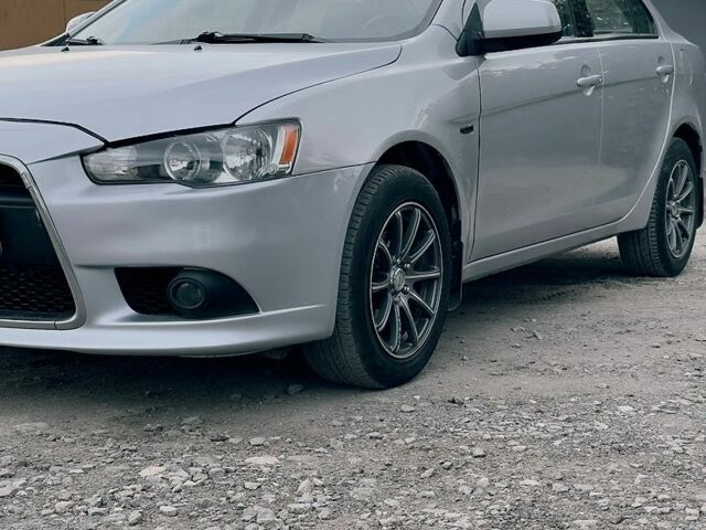 Сірий Міцубісі Lancer, об'ємом двигуна 1.59 л та пробігом 124 тис. км за 7000 $, фото 1 на Automoto.ua