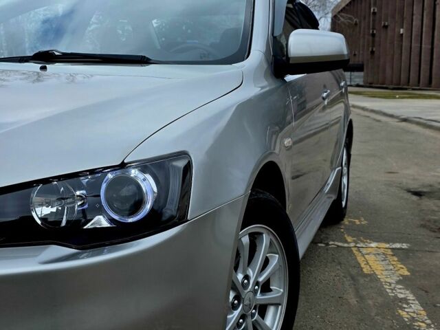 Серый Мицубиси Лансер, объемом двигателя 1.6 л и пробегом 79 тыс. км за 8500 $, фото 1 на Automoto.ua