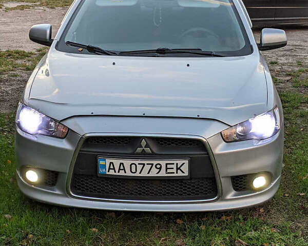 Серый Мицубиси Лансер, объемом двигателя 1.6 л и пробегом 160 тыс. км за 9700 $, фото 1 на Automoto.ua