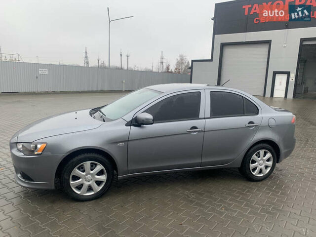 Серый Мицубиси Лансер, объемом двигателя 1.59 л и пробегом 83 тыс. км за 9900 $, фото 1 на Automoto.ua